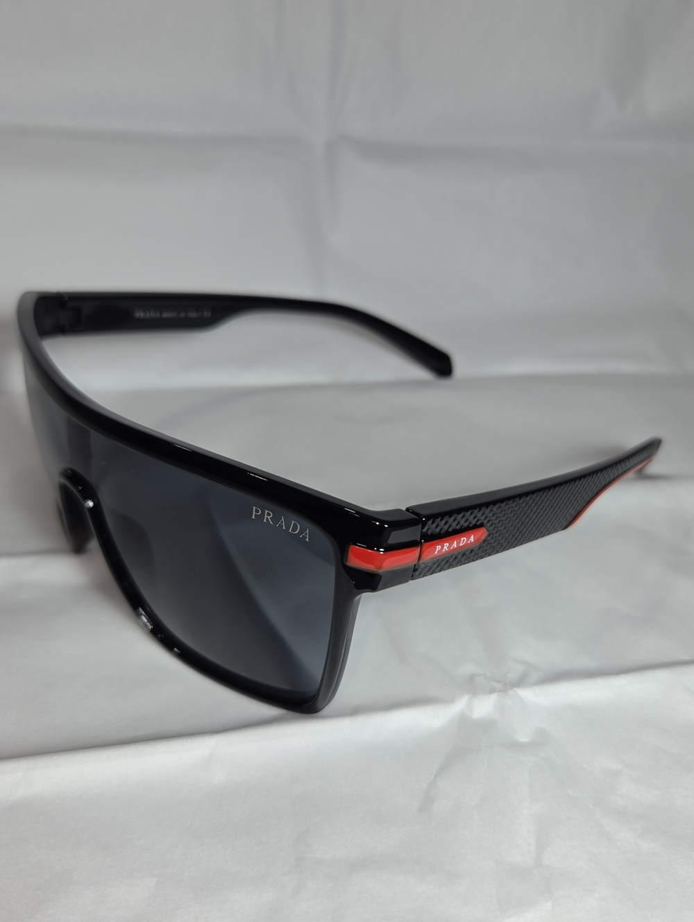 Prada Black Shield Sunglasses with Subtle Red Accent